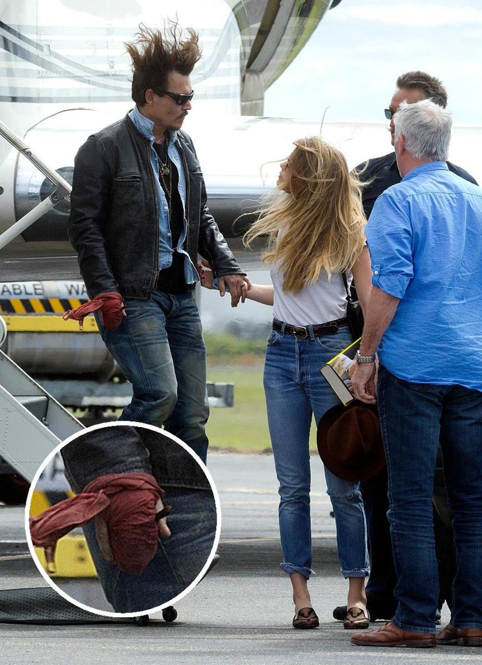 קאט. ג'וני דפ והיד החתוכה עם אמבר הרד בשנה שעברה (צילום: Splashnews)