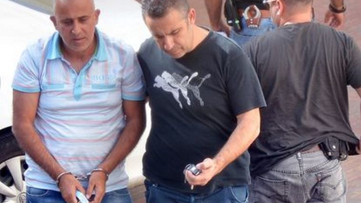  העבריין אבי רוחן מובא למעצר. גם הוא חשוד במעורבות במעורבות ניסיונות חיסול. צילום: יוסי זליגר, פלאש 90