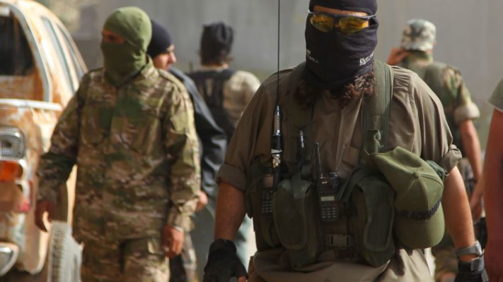 אנשי ג'בהת אל נוסרה בעיר אריחה בסוריה. צילום: רויטרס