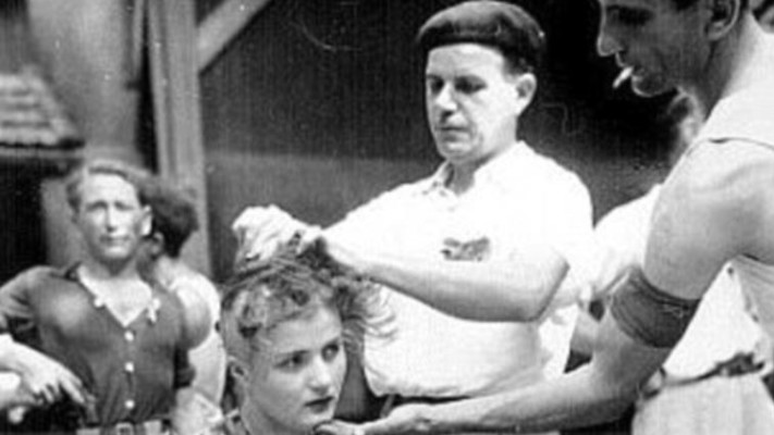 גילוח ראשה של אשה צרפתיה בזנות עקב כך שקיימה יחסי מין עם גרמני בתקופת מלחמת העולם השנייה, צרפת. צילום מסך