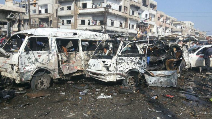 אוטובוסים חרוכים עקב סדרת פיגועים בעיר חומס בסוריה. צילום: רויטרס