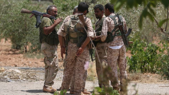 מורדים כורדים בעיר מנביג'. צילום: רויטרס