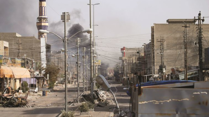 "אובמה באוויר, קאסם סולימאני על הקרקע". רחובות פלוג'ה, שלשום. צילום: רויטרס 