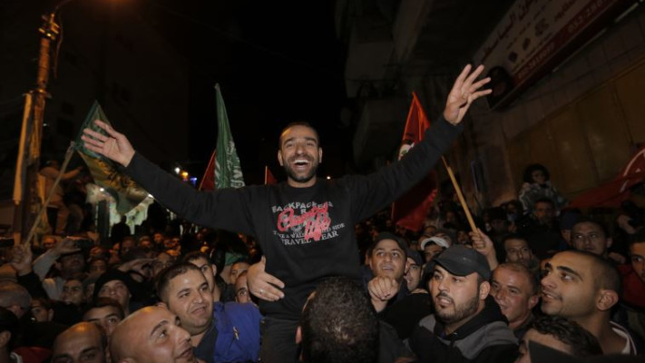 &quot;יוצאים שמנמנים משכילים ומלאי מרץ&quot; אסיר ביטחוני חוגג את שחרורו, צילום: רויטרס