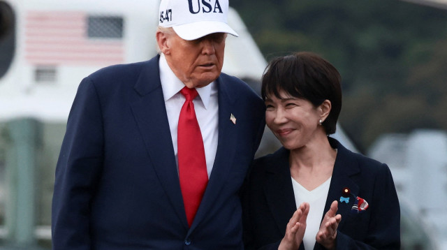 סנאה טאקאיצ'י, דונלד טראמפ (צילום: REUTERS/Evelyn Hockstein)