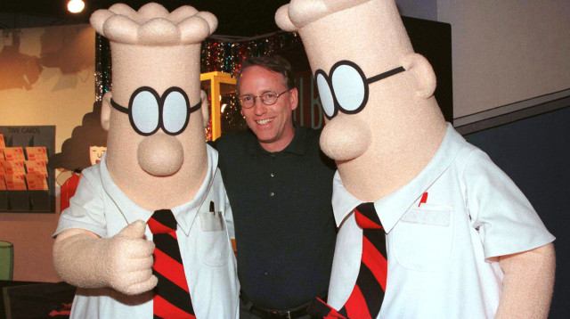 סקוט אדמס ודמויות מתוך הקומיקס "דילברט" (צילום: רויטרס)