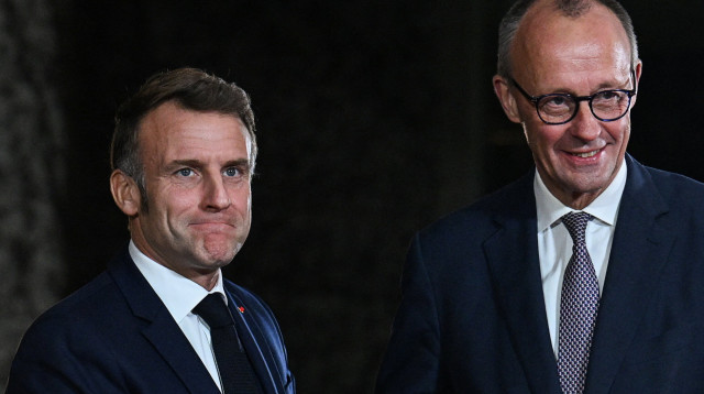 פרידריך מרץ, עמנואל מקרון (צילום:  REUTERS/Annegret Hilse)