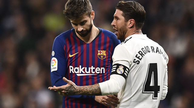 סרחיו ראמוס, ג'רארד פיקה (צילום: OSCAR DEL POZO/AFP/Getty Images)