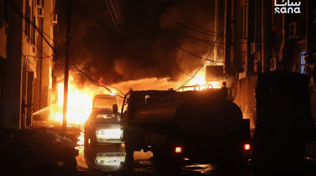 שריפה בסוריה בעקבות הפרעות (צילום: סוכנויות הידיעות)