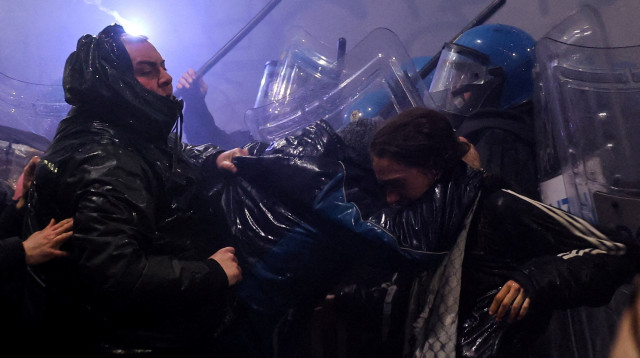 מחאה באולימפיאדת החורף במילאנו (צילום: REUTERS/Claudia Greco)