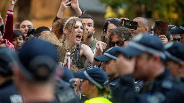 מפגינים נגד ביקורו של הרצוג באוסטרליה (צילום: REUTERS/Jeremy Piper)