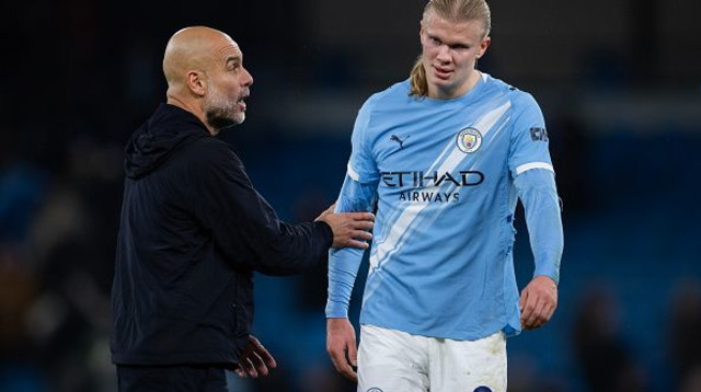 ארלינג הולאנד ופפ גווארדיולה (צילום: Visionhaus)