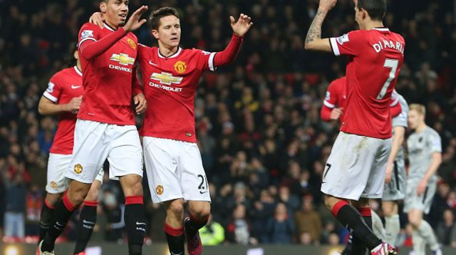 אנחל די מריה, אנדר הררה וכריס סמולינג במדי מנצ'סטר יונייטד (צילום: Matthew Peters)