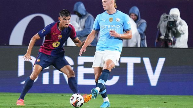 ארלינג הולאנד במפגש מול ברצלונה (צילום: Rich Storry)