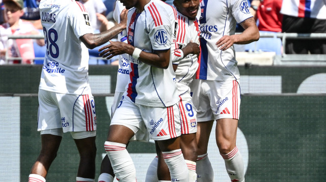 שחקני ליון חוגגים (צילום: GettyImages, ARNAUD FINISTRE/AFP)