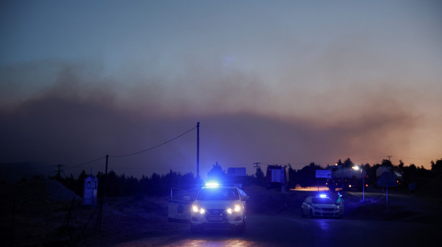 משטרת יוון (צילום: REUTERS/Louisa Gouliamaki)