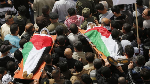 הלוויה פלסטינית בחברון (צילום: רויטרס)