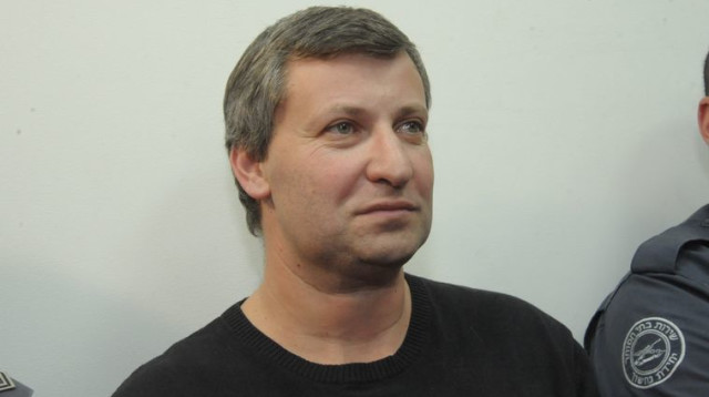 סטס מיסז'ניקוב במעצר (צילום: אבשלום ששוני)