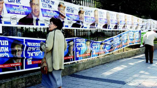 כרזות בחירות של נתניהו והרצוג (צילום: אבשלום ששוני)