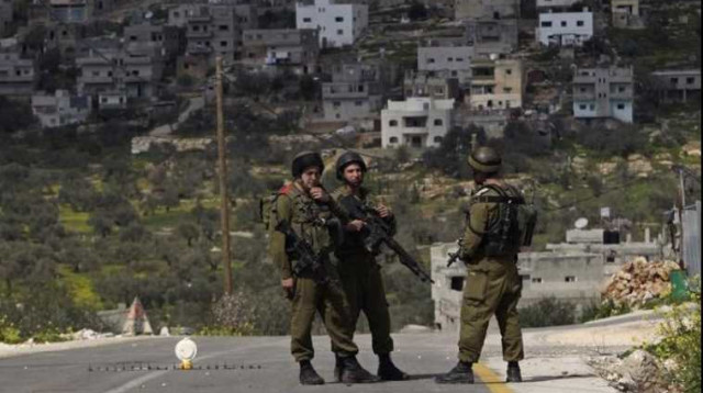 חיילים במחסום בגדה המערבית  (צילום: רויטרס)