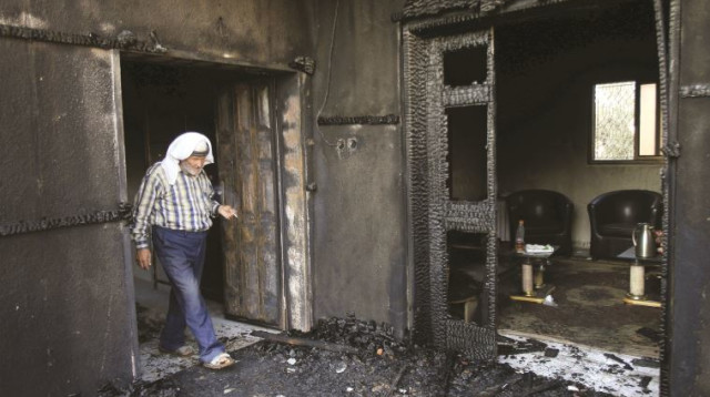 בית משפחת דוואבשה לאחר הפיגוע (צילום: רויטרס)