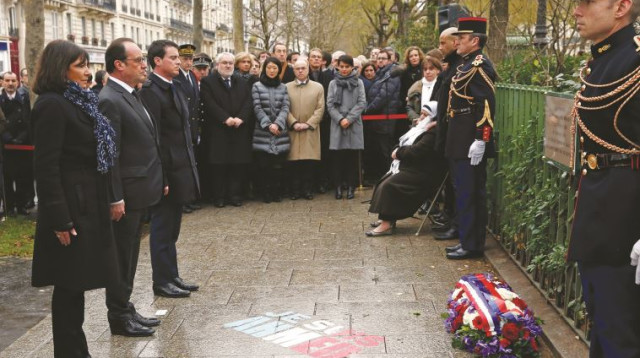 הנשיא הולנד בטקס הזיכרון לנרצחי ״שארלי הבדו״ (צילום: רויטרס)