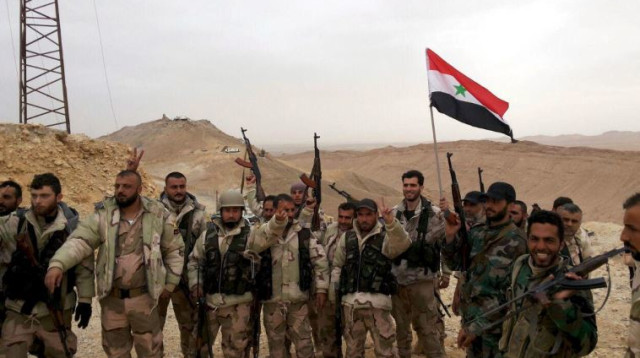 כוחות התומכים באסד בתדמור, סוריה (צילום: רויטרס)