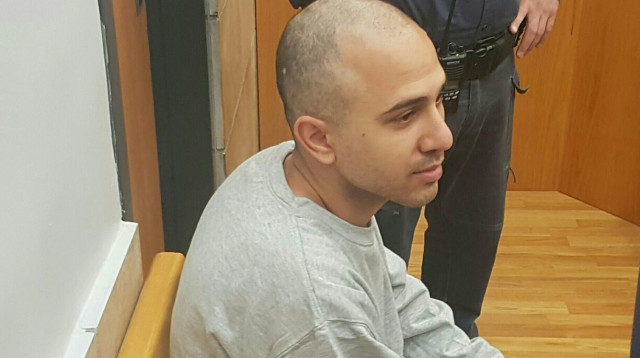 נדב סלע בבית המשפט בעת הגשת כתב האישום (צילום: דוברות המשטרה)