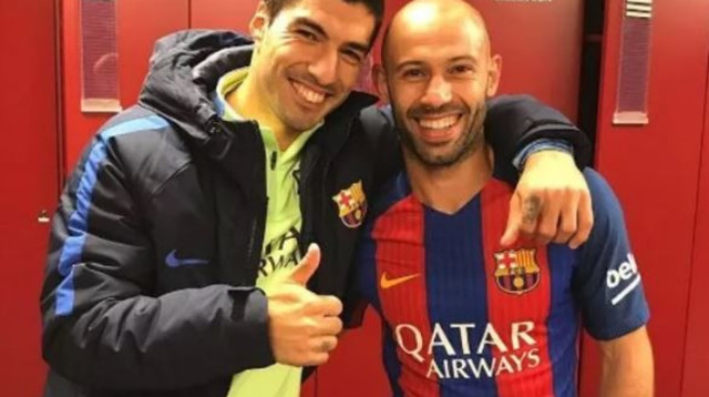 מסצ'ראנו ולואיס סוארס (צילום: AFP)