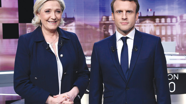 עמנואל מקרון ומארין לה פן בעימות ביניהם (צילום: AFP)