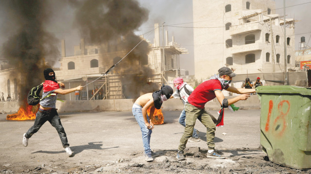 עימותים בין פלסטינים לכוחות הביטחון (צילום: רויטרס)