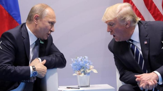 טראמפ עם פוטין (צילום: רויטרס)