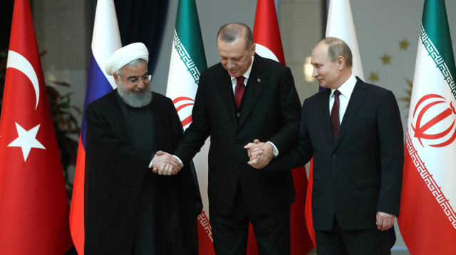 ולדימיר פוטין, ארדואן חסן רוחאני (צילום: AFP)