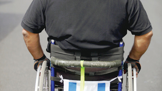 נכה פגוע גפיים, אילוסטרציה (למצולם אין קשר לנאמר בכתבה) (צילום: אביר סולטאן, פלאש 90)