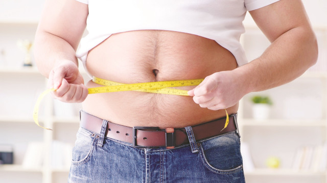 איש שמן (צילום: אינג אימג')