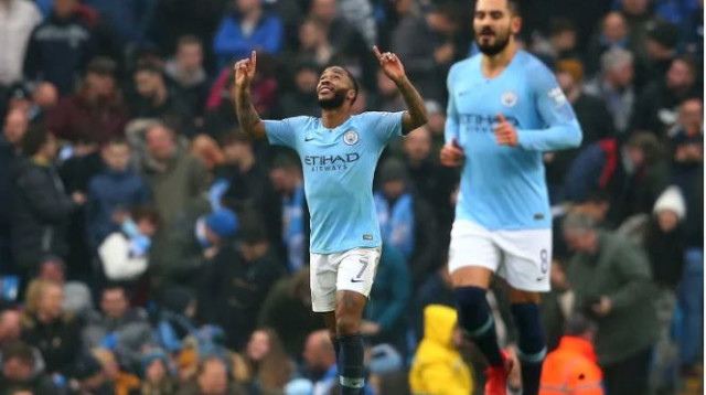 ראחים סטרלינג עם אילקאי גונדואן (צילום: AFP)