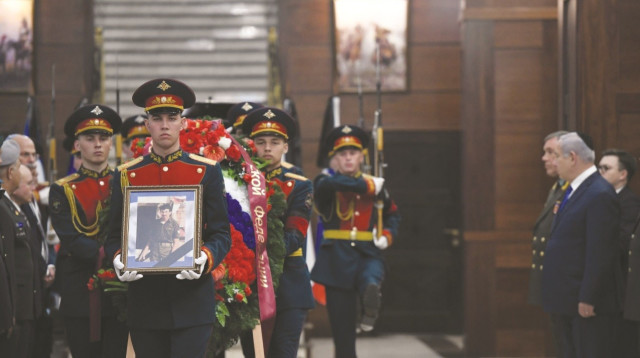 הארון של זכריה באומל עם תמונתו (צילום: דובר צה"ל)