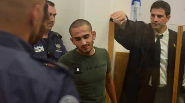 החשוד בהצתת ביתה של כרמל מעודה (צילום: אבשלום ששוני)