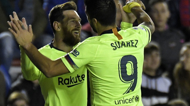 ליאו מסי עם לואיס סוארס (צילום: AFP)