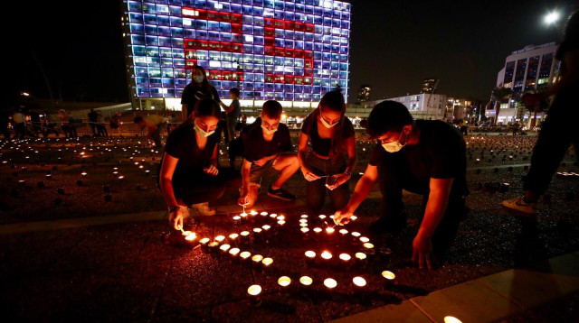 הדלקת נרות לזכר יצחק רבין  (צילום: רונן טופלברג,מרכז יצחק רבין)