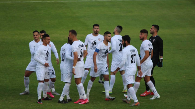 שחקני הפועל איכסל חוגגים (צילום: חשבון הפייסבוק הרשמי של הפועל איכסל, חמודי חליילה)