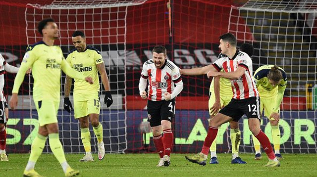 שחקני שפילד יונייטד חוגגים (צילום: OLI SCARFF/POOL/AFP via Getty Images)