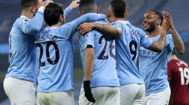 שחקני מנצ’סטר סיטי חוגגים (צילום: CLIVE BRUNSKILL/POOL/AFP via Getty Images)
