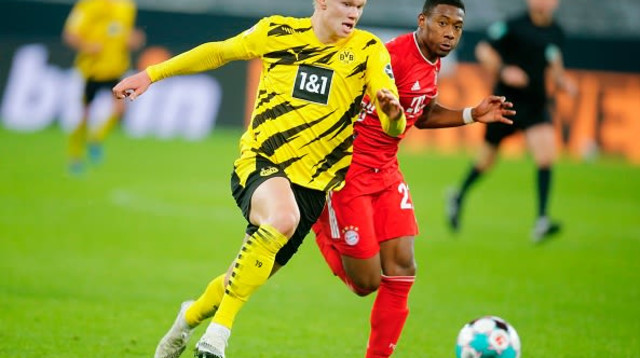 ארלינג הולאנד, דויד אלאבה (צילום: LEON KUEGELER/POOL/AFP via Getty Images)