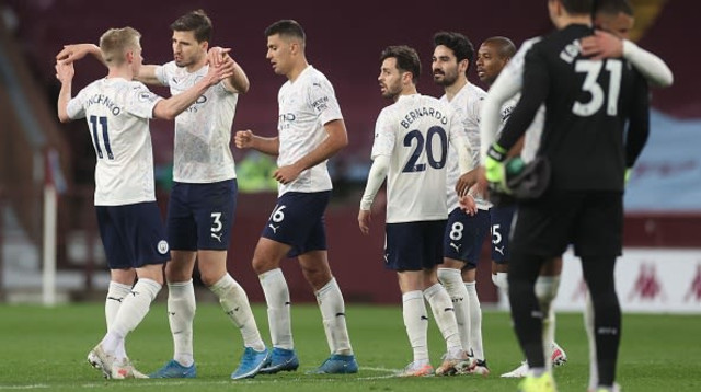 שחקני מנצ'סטר סיטי (צילום: CARL RECINE/POOL/AFP via Getty Images)