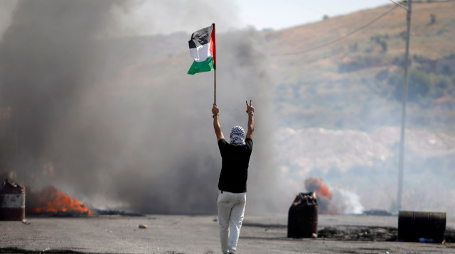 פלסטינים בהפרות סדר ביהודה ושומרון (צילום: REUTERS/Raneen Sawafta)