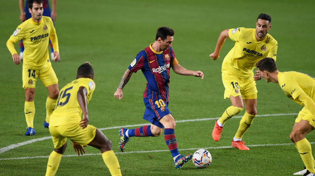 ליאו מסי, שחקני ויאריאל (צילום: JOSEP LAGO/AFP via Getty Images)