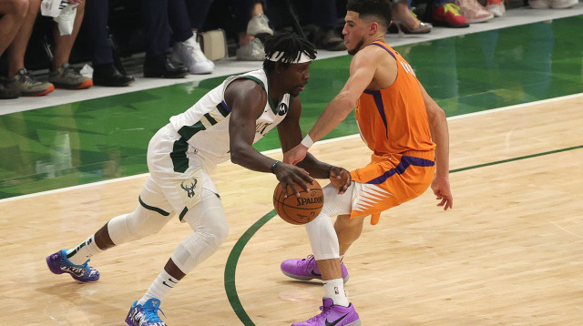 דווין בוקר, ג'רו הולידיי (צילום: Stacy Revere/Getty Images)