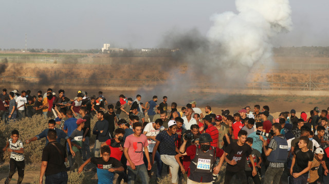 הפגנות ליד הגדר בעזה  (צילום: רויטרס)