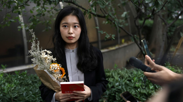 המתמחה שהתלוננה, ז'ואו שיאושואן (צילום: REUTERS/Tingshu Wang)